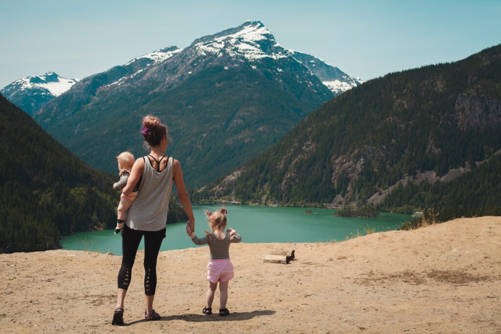 mother and children at lake